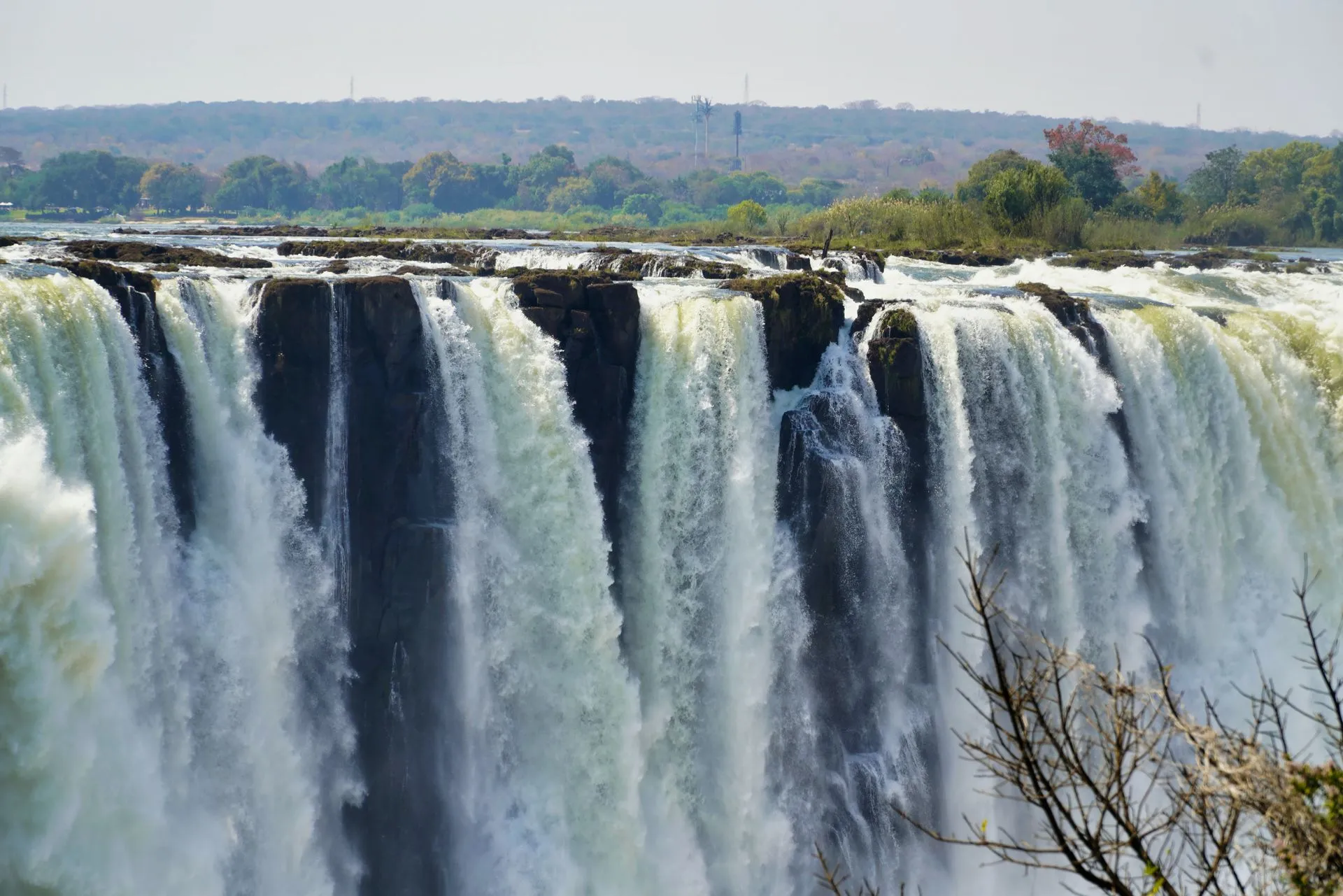 A breathtaking view of Victoria Falls in Zimbabwe, showcasing its powerful waterfalls and lush surrounding landscape.
